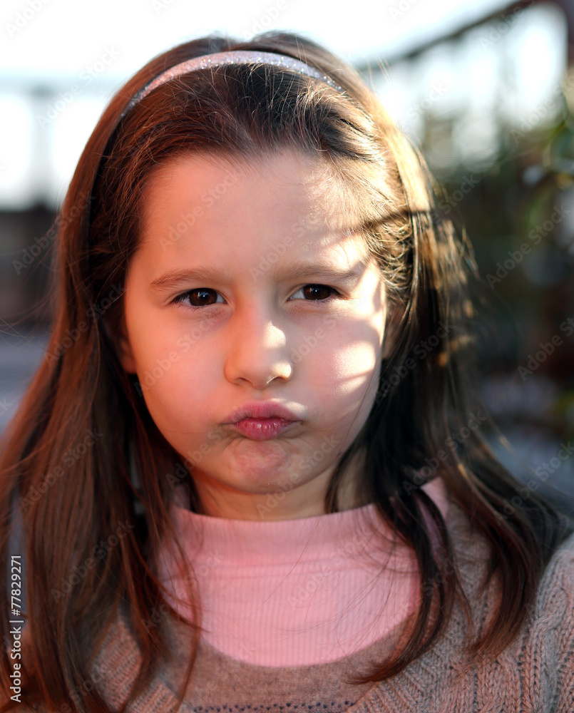 European child angry with a wool sweater European child angry with a wool sweater