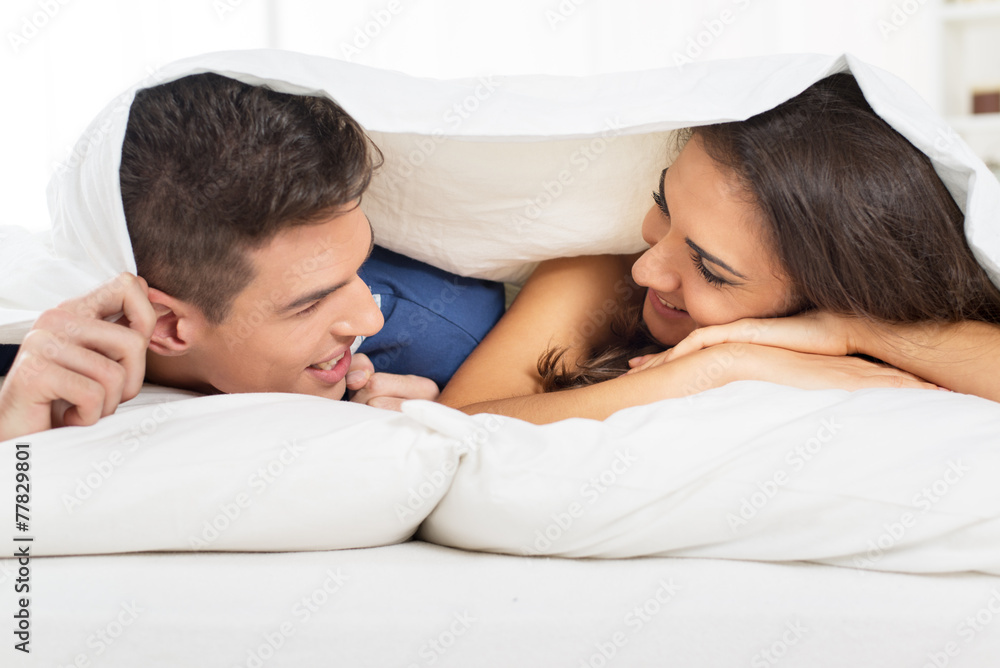 Young Couple Under The Duvet Young Couple Under The Duvet