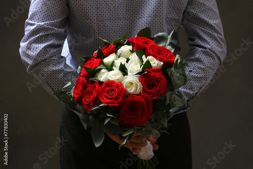 Man with flowers behind