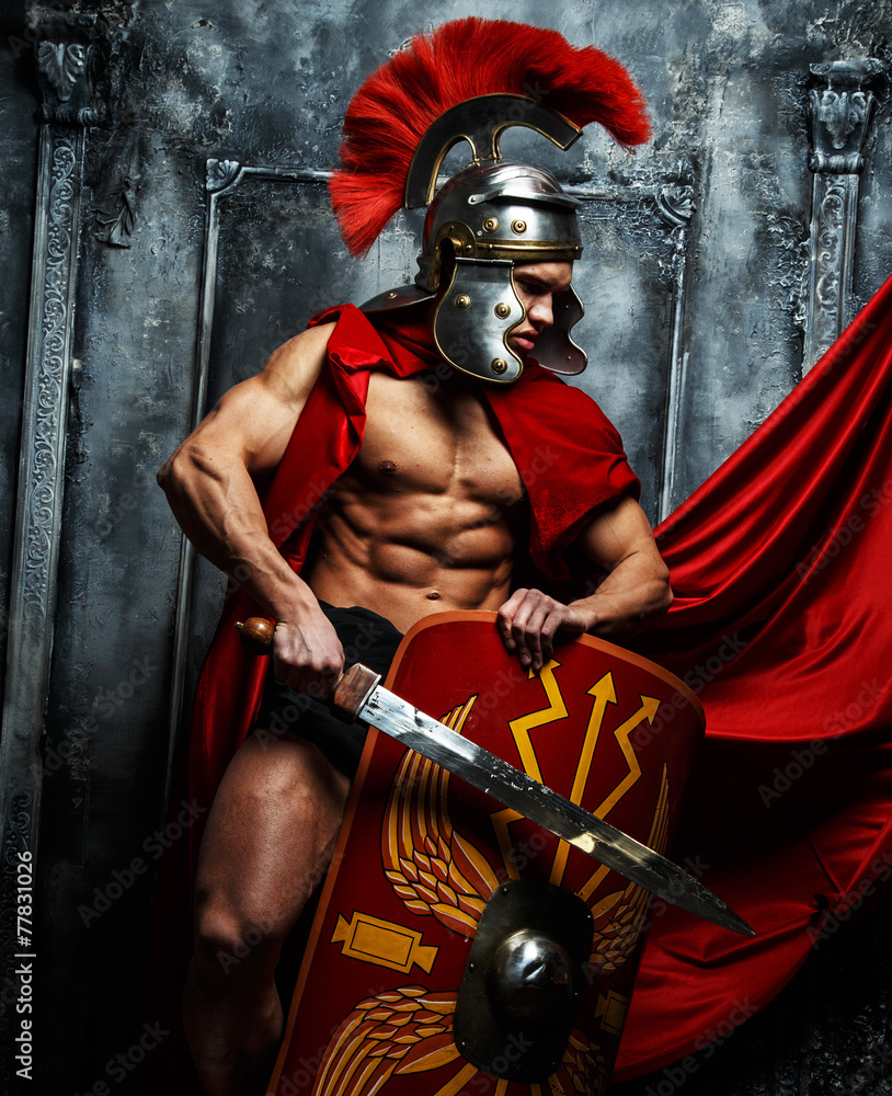 Roman warrior with muscular body holding sword and shield Roman warrior with muscular body holding sword and shield