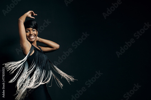 happywoman is dancing wearing pretty dress photo