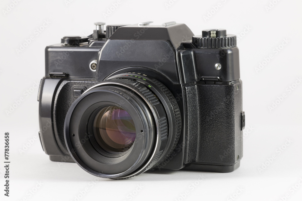 Old SLR camera isolated on white background Old SLR camera isolated on white background
