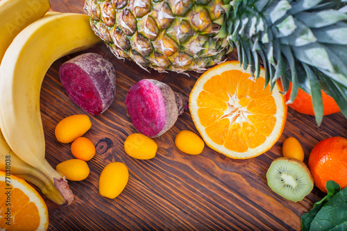 Fresh fruit and vegitables on wooden table photo