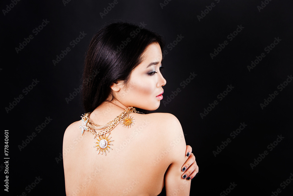 Beautiful fashion asian model with long hair and luxury jewerly