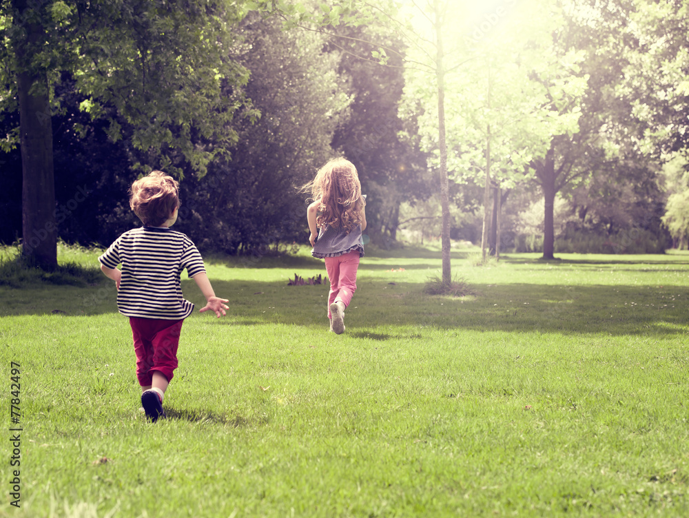 Fototapeta premium Happy children running at mead