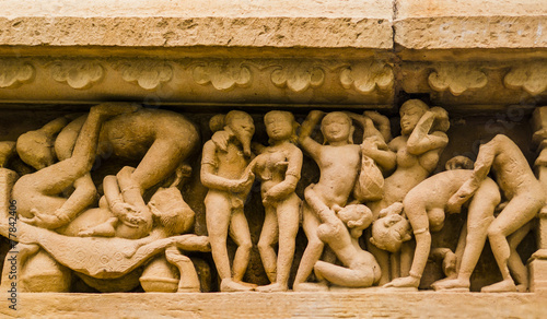 Stone carved erotic sculpture in Khajuraho temple, India