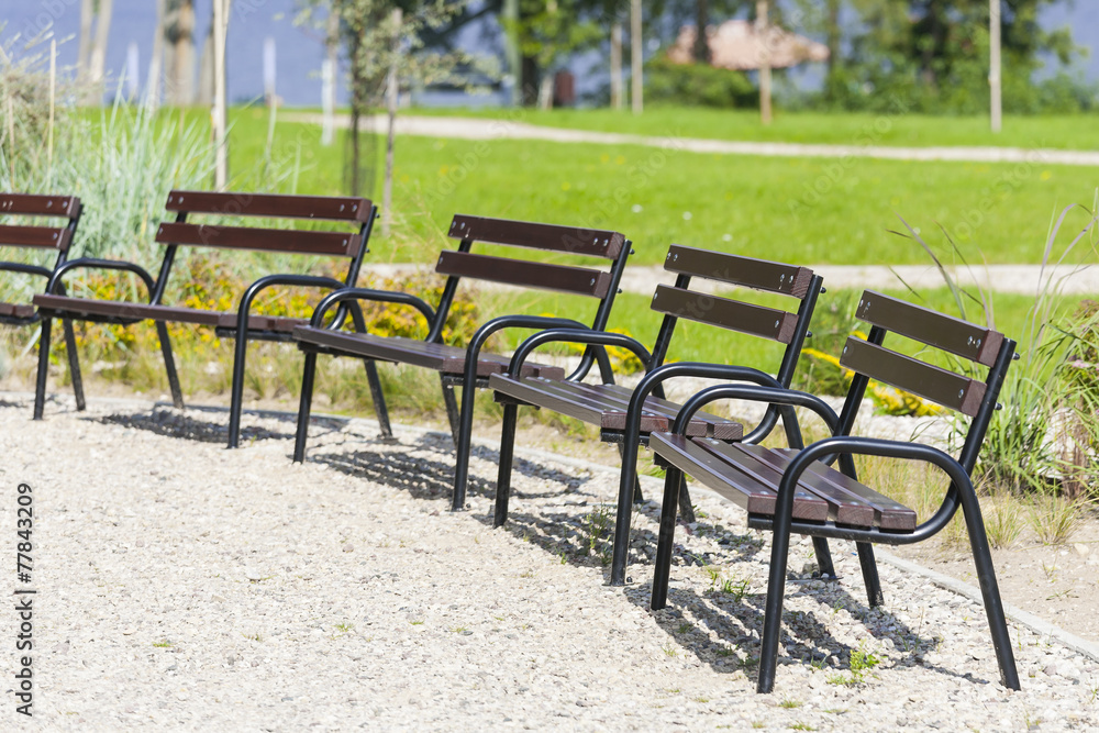 Benches standing in a park.