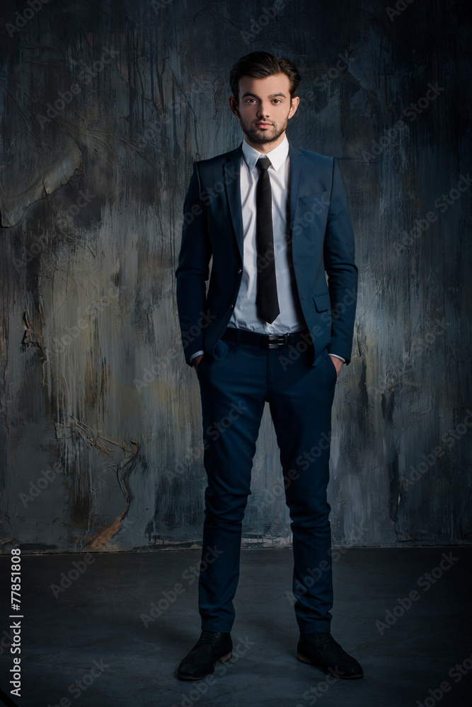 Portrait of a serious businessman in blue suit