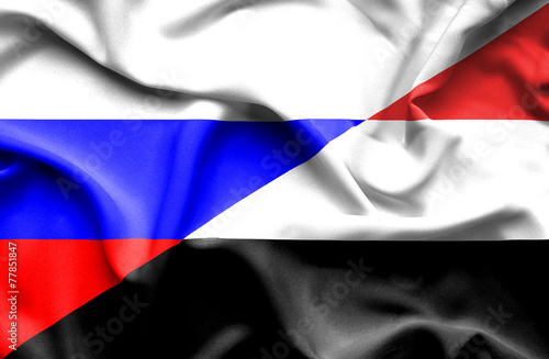 Waving flag of Yemen and Russia