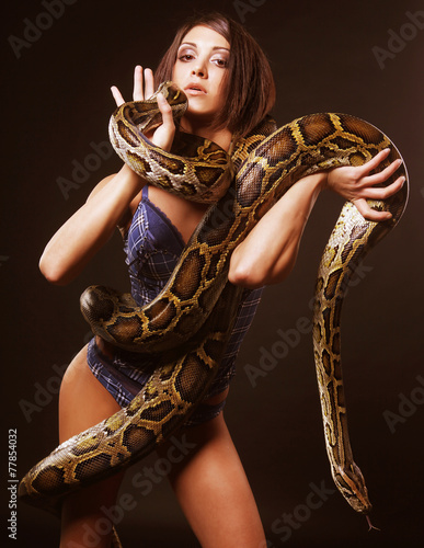 sexy brunette holding python