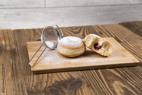 Jummy donuts on wooden table