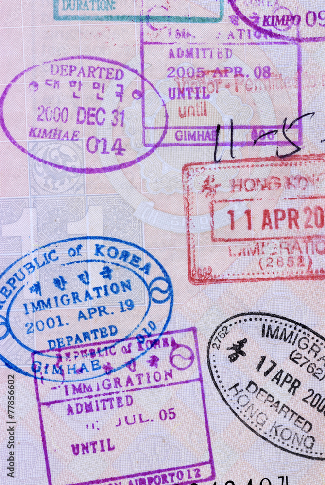 Fototapeta premium Asian passport page with various exit and entry stamps