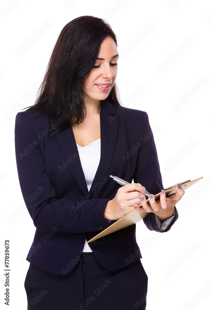 Businesswoman write on clipboard Businesswoman write on clipboard