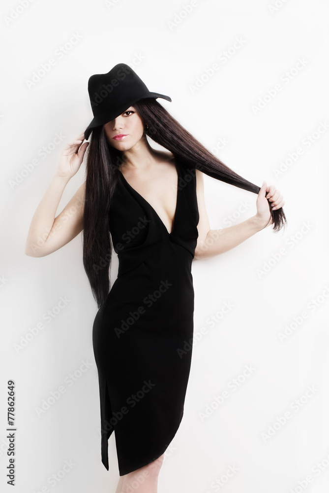 Young and beautiful woman in hat over white background Young and beautiful woman in hat over white background
