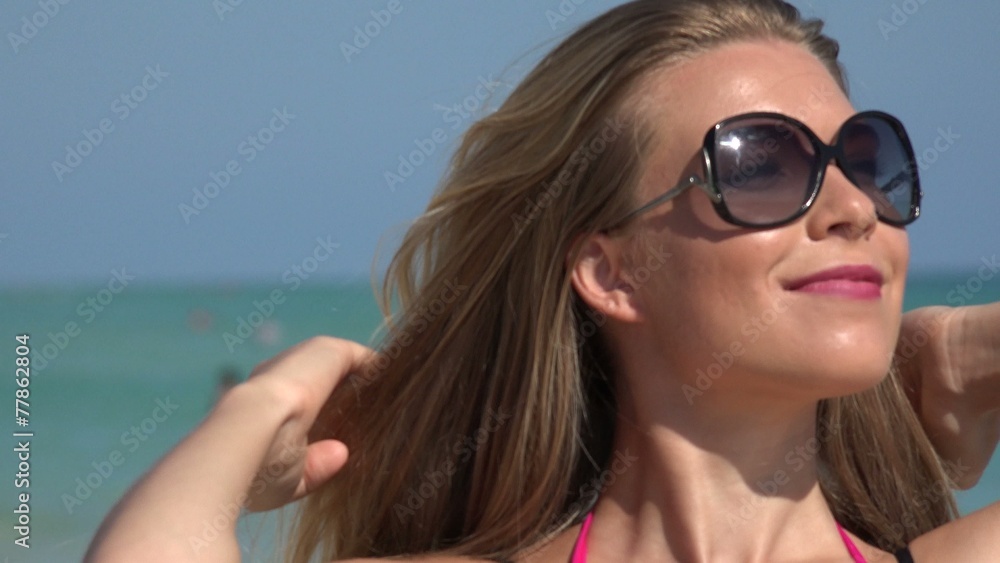 Woman with Sunglasses Walking at Ocean Woman with Sunglasses Walking at Ocean