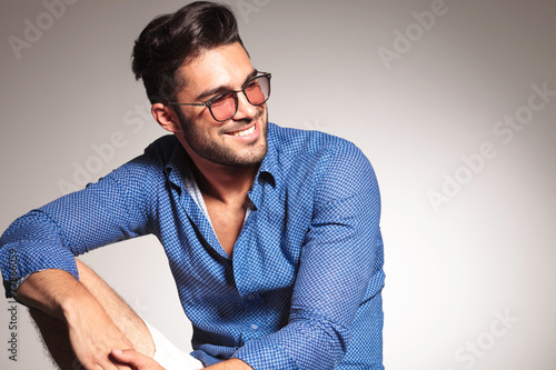 Portrait of a handsome fashion man smiling photo