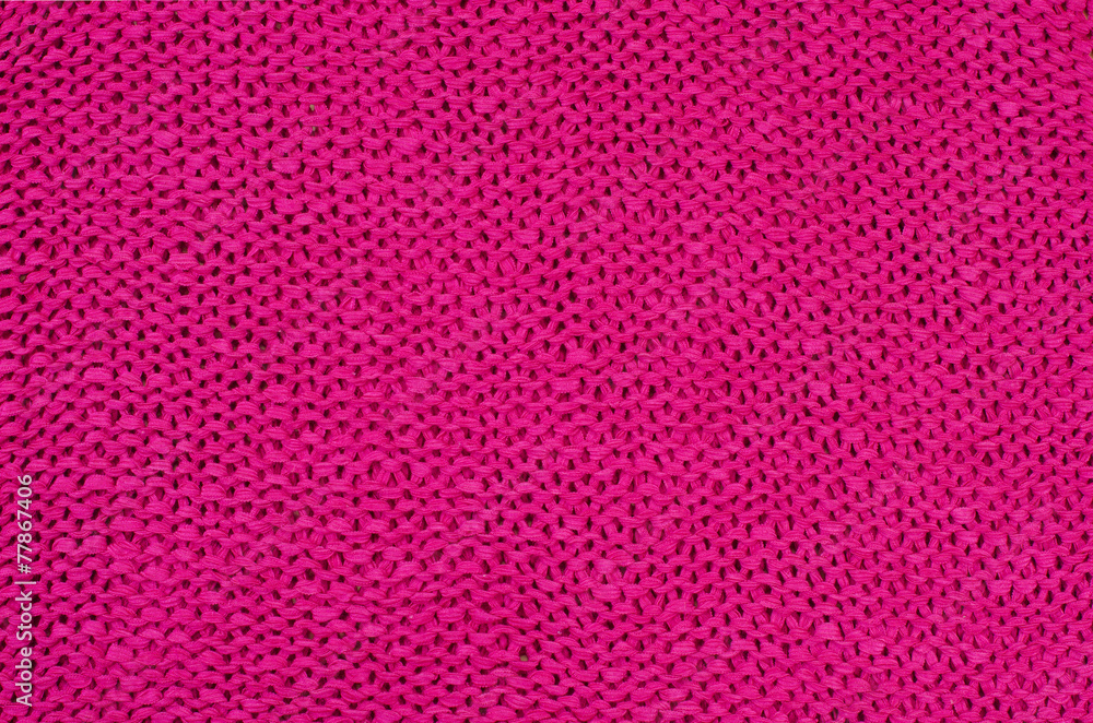 Pink knit woolen texture.Magenta woven thread as a background. Pink knit woolen texture.Magenta woven thread as a background.