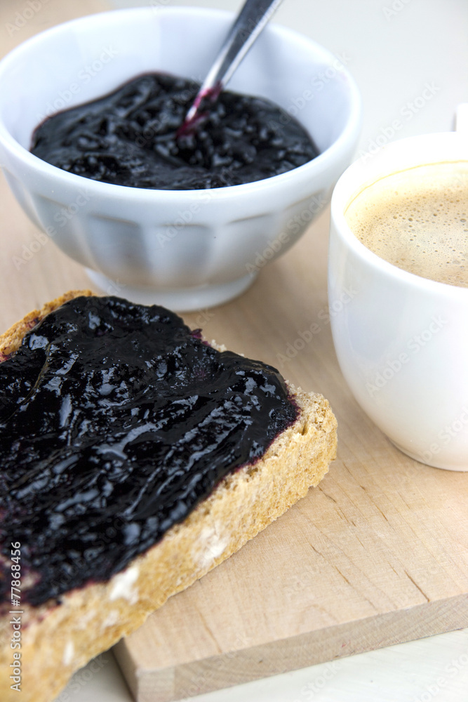 Homemade blueberry jam with integral bread and coffe Homemade blueberry jam with integral bread and coffe
