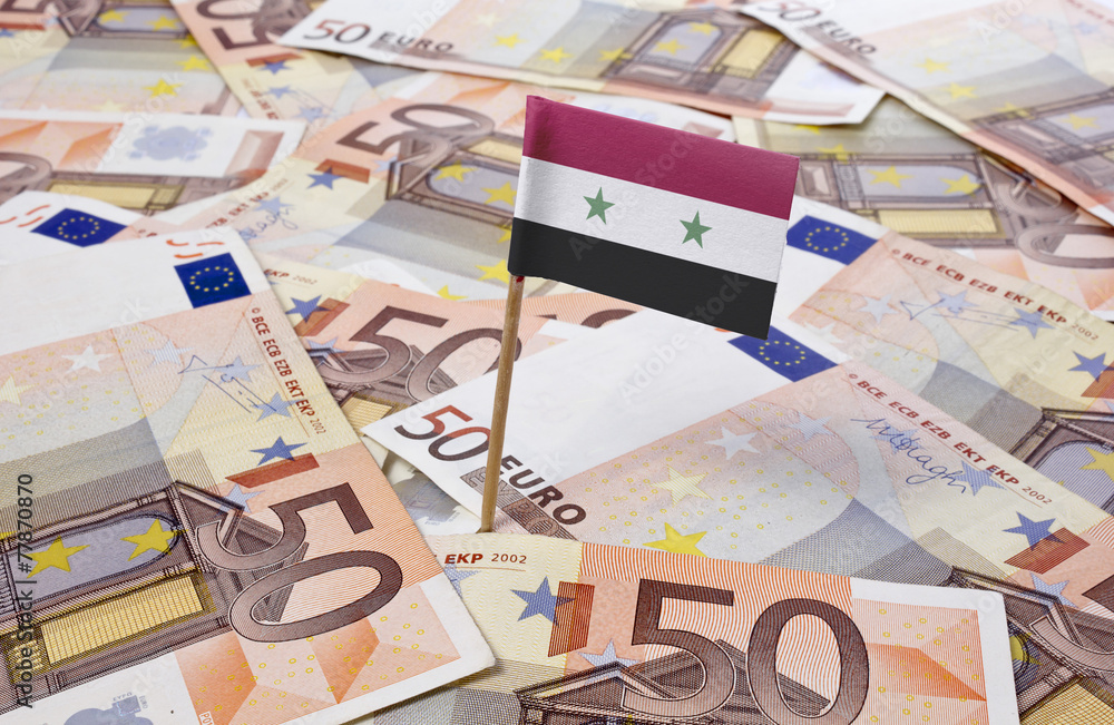 Flag of Syria sticking in 50 Euro banknotes.(series) Flag of Syria sticking in 50 Euro banknotes.(series)
