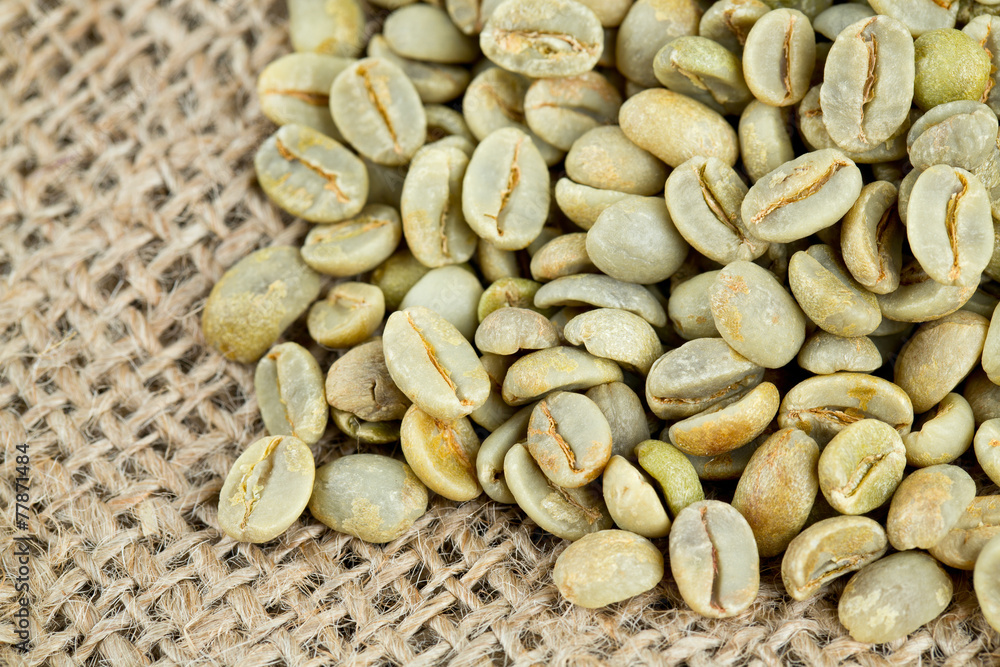 green coffee beans on sack