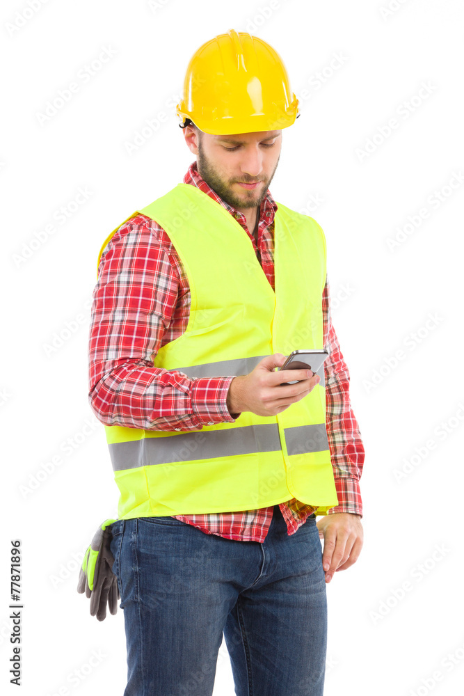 Pensive worker sending a text message Pensive worker sending a text message