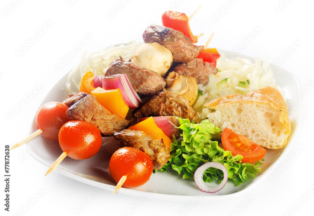 Gourmet Kebabs on Plate with Bread and Veggies Gourmet Kebabs on Plate with Bread and Veggies