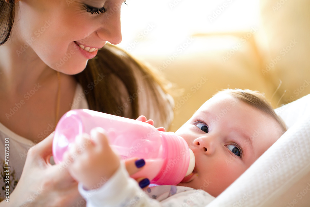 mother feeds baby