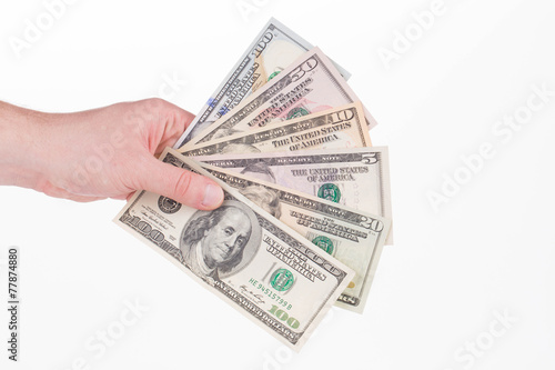 Hand holding dollar bills