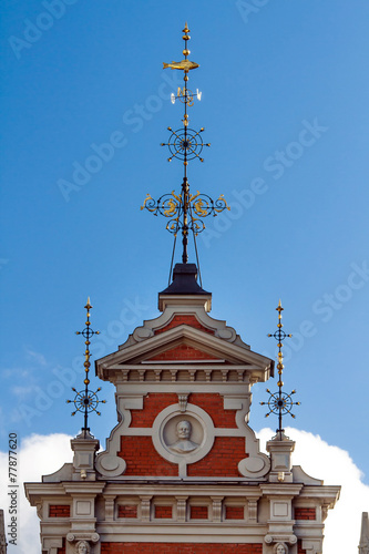 Golden spire on the tower of House of the Blackheads in Riga