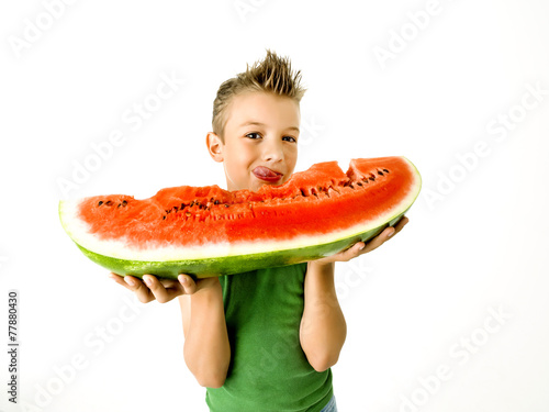 punk boy eating a big slice of watermelon