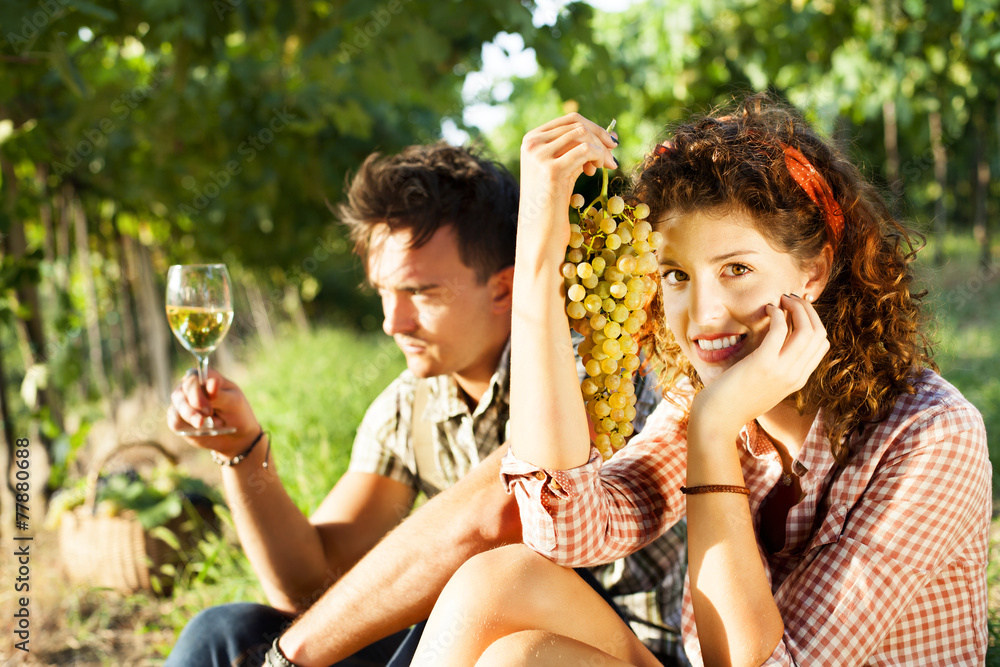 Fototapeta premium farming couple relaxing after the grape harvest