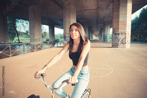 young beautiful brunette straight hair woman using bike © Eugenio Marongiu