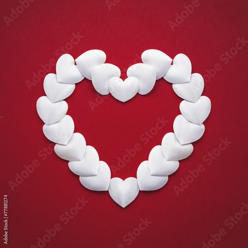 Valentines day heart on red background photo