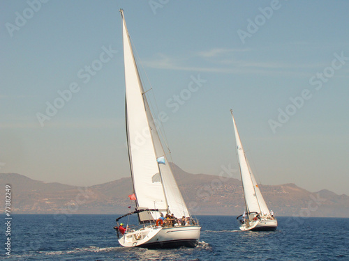 two yachts under sail reaching each other