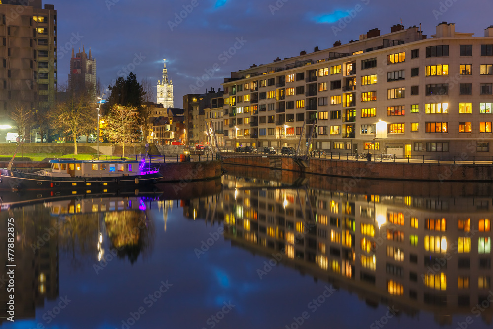 River Leie, colored houses and Belfry tower in Ghent, Belgium