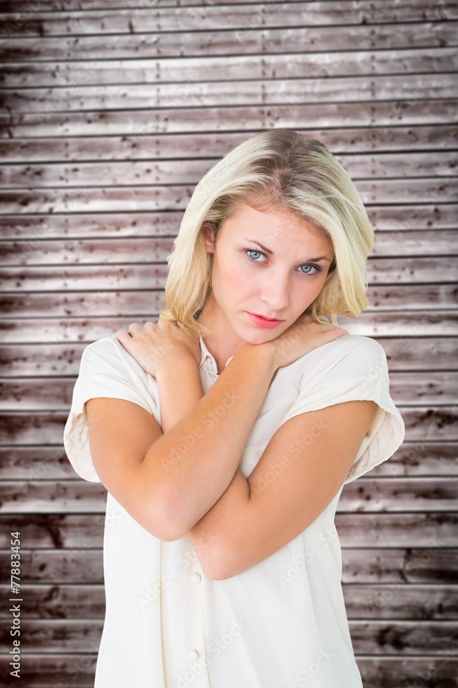 Composite image of sad pretty blonde looking at camera