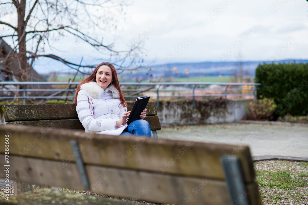 Woman with tablet outdoor