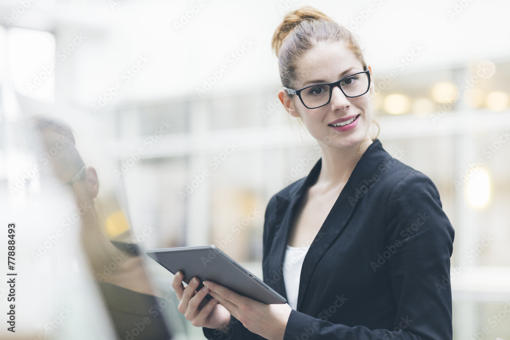 Businesswoman using a Digital tablet Businesswoman using a Digital tablet
