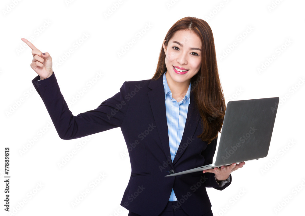 Businesswoman use of laptop and finger point up Businesswoman use of laptop and finger point up