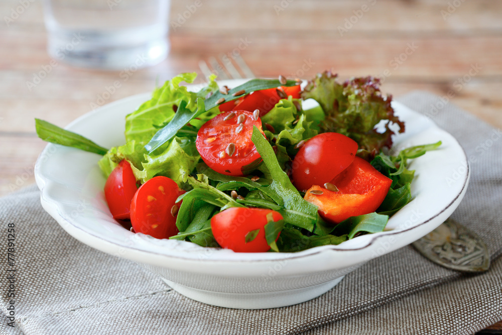 salad with vegetables in a plate on the napkin