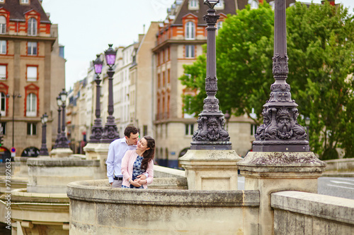 Couple in Paris on a bridge