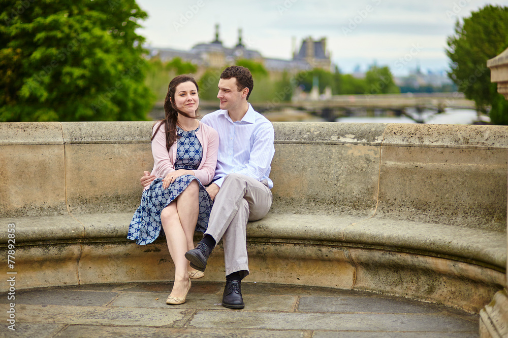Couple in Paris on a bridge Couple in Paris on a bridge