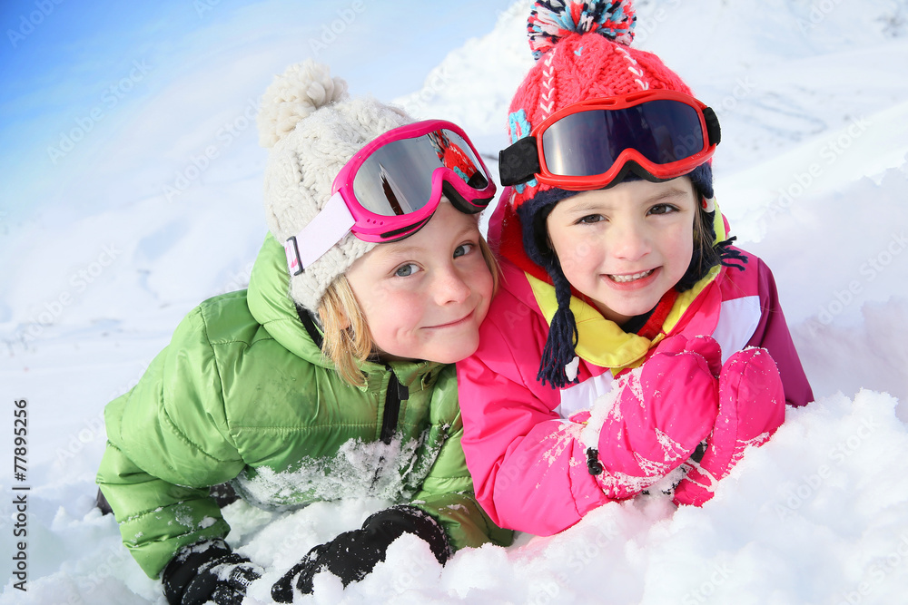 Portrait of kids enjoying winter vacation at ski resort - obrazy, fototapety, plakaty 