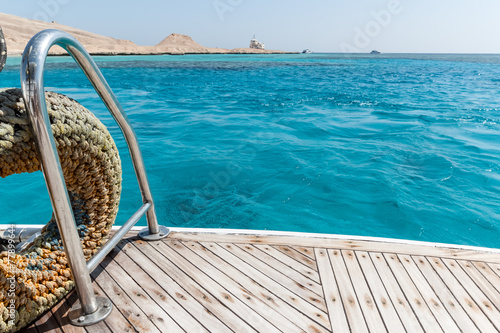 Close-up of a wooden deck end of a yacht © yarlander