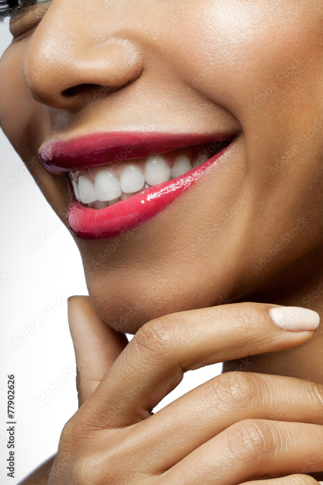 Fototapeta premium Smiling black woman with healthy beautiful white teeth
