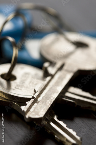 Macro Shot of Conceptual House Keys on Top of Wooden Table