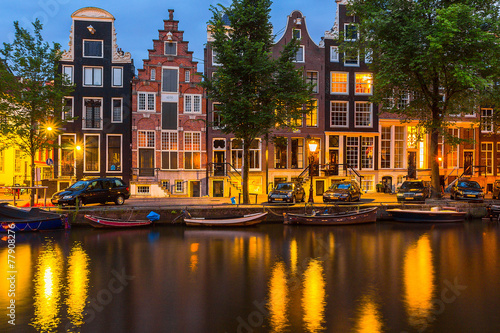 Night illumination of Amsterdam canal and bridge 