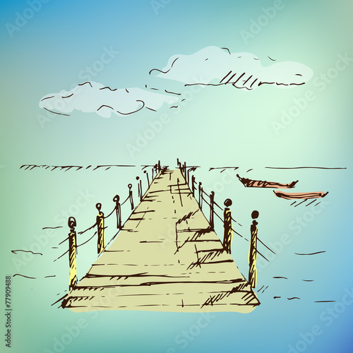 Wooden pier at sea on blurred background.