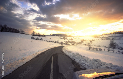 Beautiful  sunset in january with a road ahead