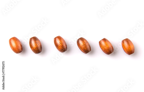Wallpaper Mural Brown round wooden beads over white background Torontodigital.ca